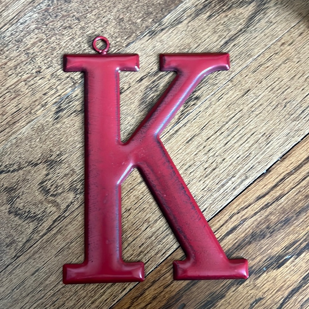 Red metal “K” monogram Christmas ornament